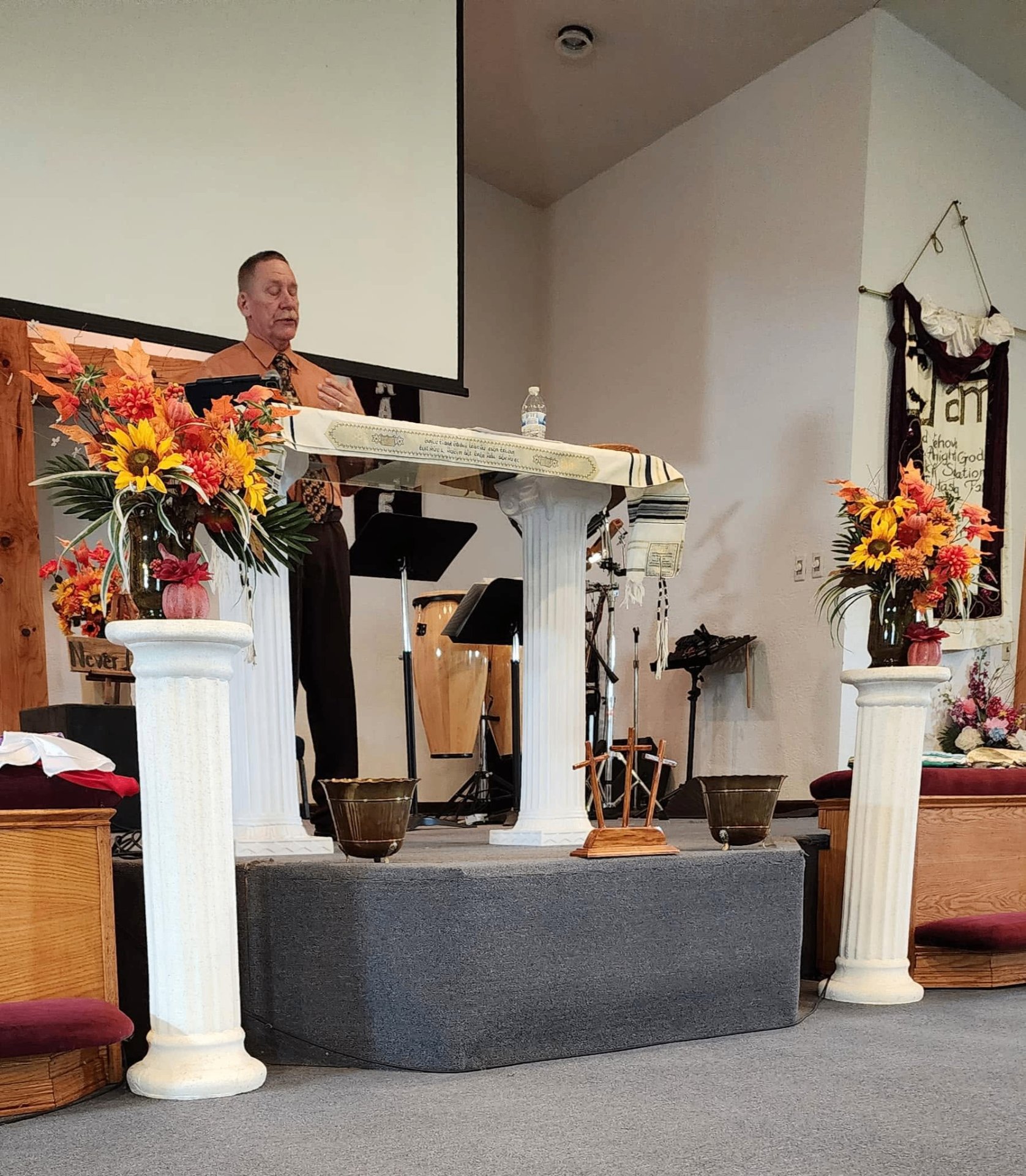 A pastor preaching during a Sunday service at A New Beginning Church